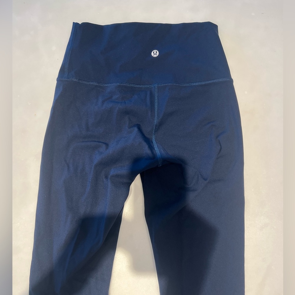 Navy blue size 4 lululemon leggings. Never worn but tag ripped off